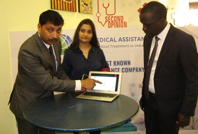 Abhik Moitra (R) demonstrating how the portal works. Left is AAR’s Mohammed Ssebale.